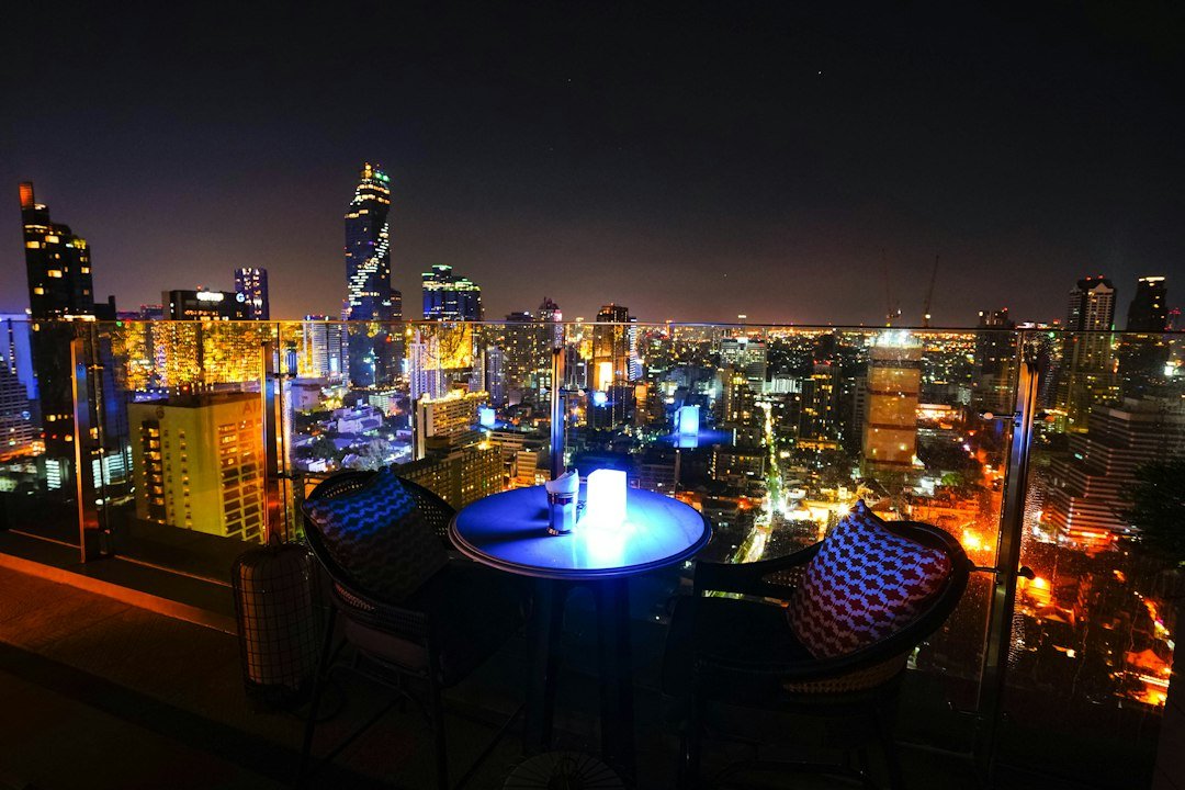 Rooftop bar overlooking the Bangkok skyline at night