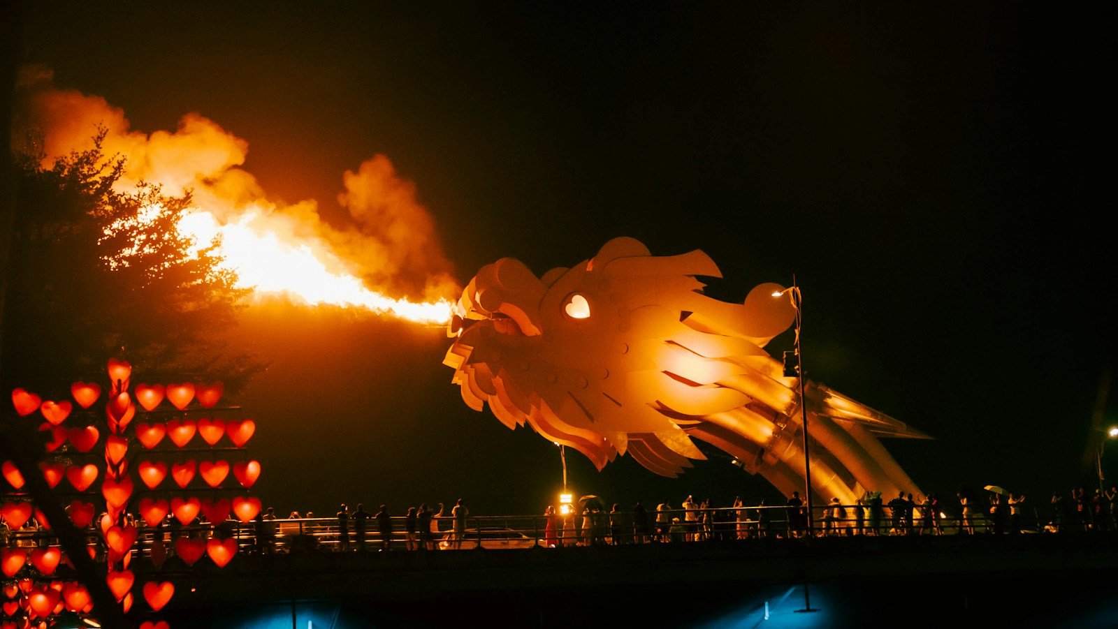 Dragon Bridge breathing fire at night in Da Nang