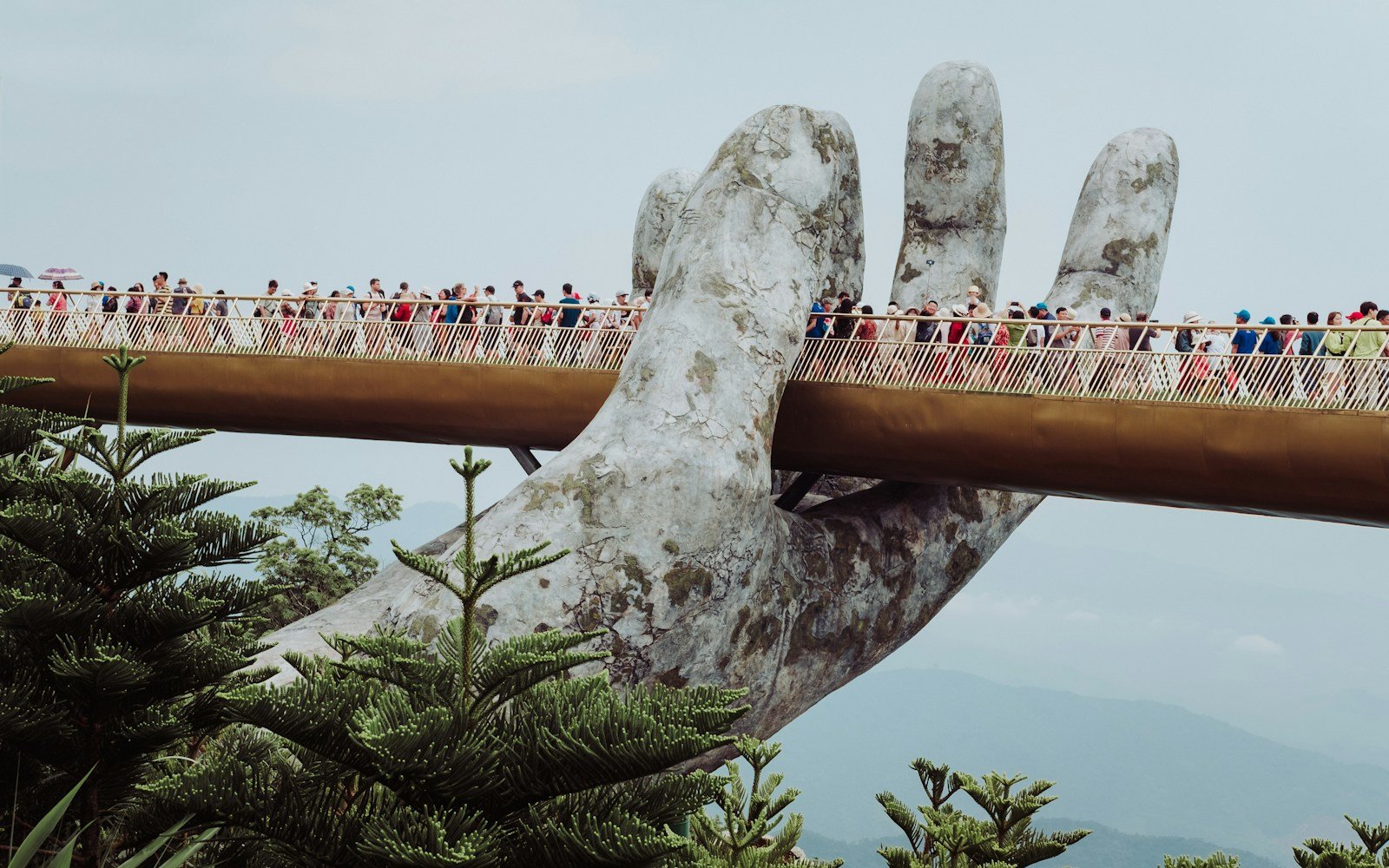 Golden Bridge supported by giant stone hands at Ba Na Hills