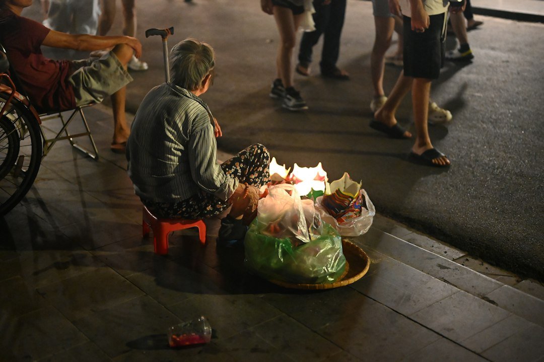 Street food vendor preparing food in Hoi An, Vietnam