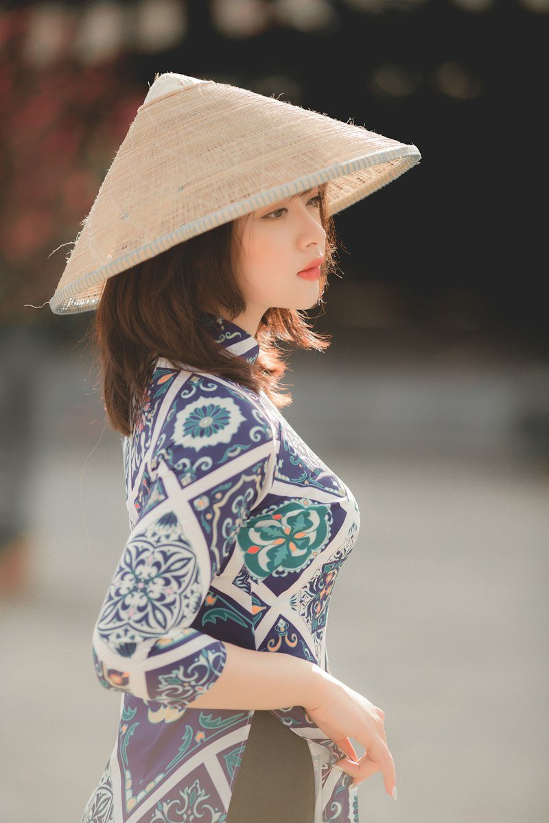 A woman wearing a traditional Vietnamese conical hat